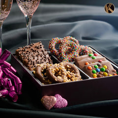 Nut Cravings KREMERY milk chocolate pretzel twists with toppings close-up.