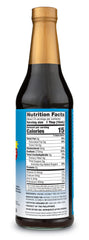 Nutiva Coconut Aminos being poured over a fresh salad as soy sauce alternative.