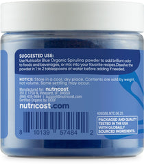 Pouring Nutricolor into a beverage to achieve natural blue hue
