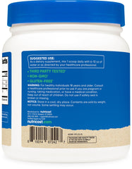Pouring Nutricost turmeric powder into a pot for flavor.