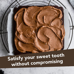 Nuts 'N More Dark Chocolate Almond Butter Spread on fruit slice for keto-friendly indulgence