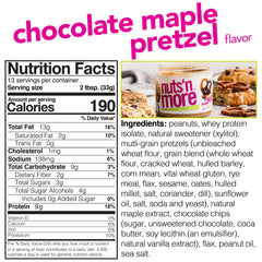 Nuts N More spoon dipping chocolate maple pretzel spread for quick protein boost.