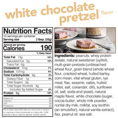 Nuts 'N More White Chocolate Pretzel Spread on spoon highlights creamy texture with a salty-sweet balance.
