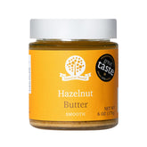 Nutural World smooth hazelnut butter jar front, pure spread for toast and snacks