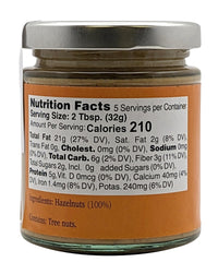 Nutural World smooth hazelnut butter jar with spoon, creamy texture for desserts