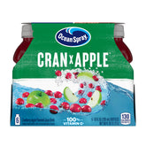 Ocean Spray Cran-Apple juice bottle on a kitchen shelf, convenient six-pack for family drinks.