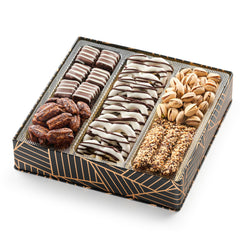 Oh! Nuts square tin closeup showing premium chocolate and nut assortment.