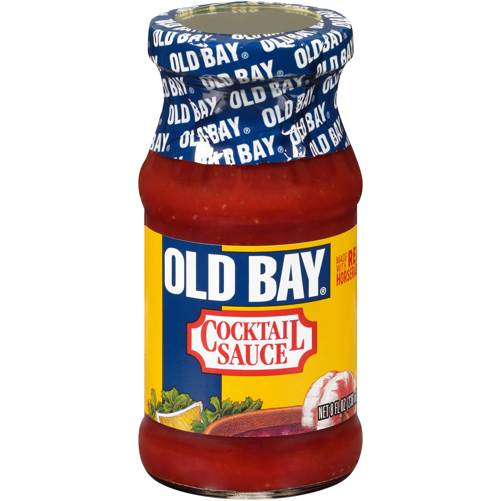 OLD BAY Cocktail Sauce bottle pouring, elevating shrimp and seafood with bold, tangy flavor.