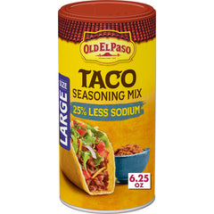 Old El Paso taco seasoning bottle pouring flavor into sizzling fillings.