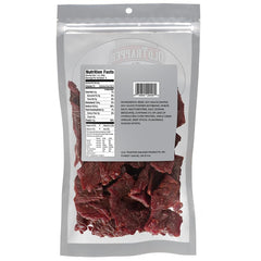 Old Trapper Zero Sugar Beef Jerky slices close-up, highlighting natural wood-smoked flavor.