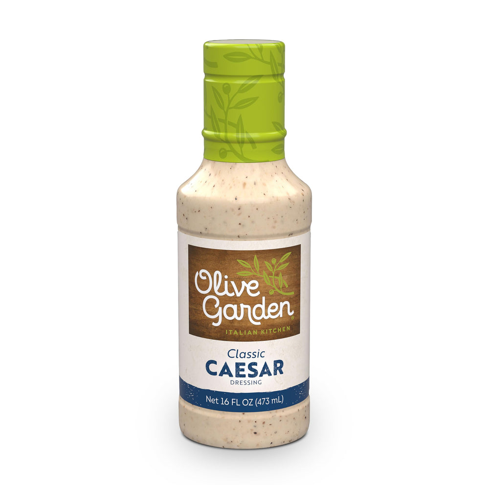 Olive Garden Classic Caesar Dressing bottle showing creamy texture for salads and meals.