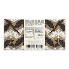 Omnom Coffee + Milk bar slice reveals creamy interior with cappuccino notes.