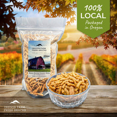 Oregon Farm Fresh Snacks Honey Roasted Sesame Sticks atop trail mix for crunch.