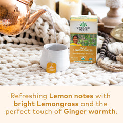 Organic India Tulsi Lemon Ginger tea brewing in a cup with steam for caffeine-free warmth.
