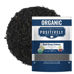 Organic Positively Tea Company Earl Grey Creme loose-leaf tea in a jar for fresh brewing.
