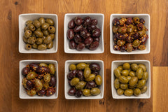 ORIGENES Mixed olives with herbs and lemon for antipasti.