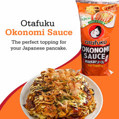 Bottle with glaze over okonomiyaki, showcasing a glossy finish.