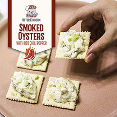 Otter Kingdom olives oil glaze on smoked oysters for silky texture.