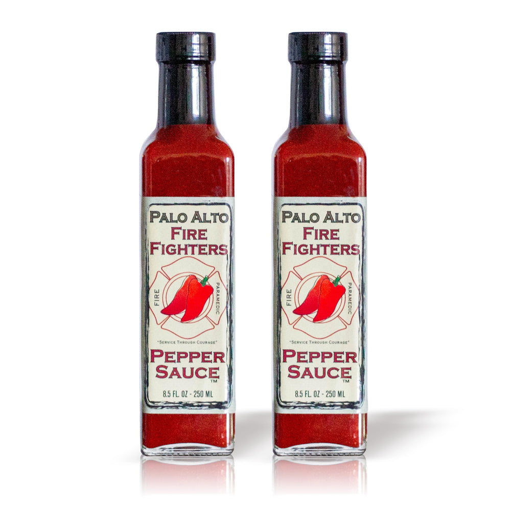 Palo Alto Firefighters Pepper Sauce bottle on counter, salt-free flavor enhancer.