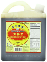 Pearl River Bridge Superior Light Soy Sauce bottle pouring for stir-fry