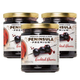 Peninsula Premium Cocktail Cherries bottle pour highlights rich cherry flavor and silky syrup.