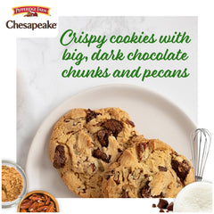 Close-up of chocolate chunks and pecans in a Chesapeake cookie highlighting texture
