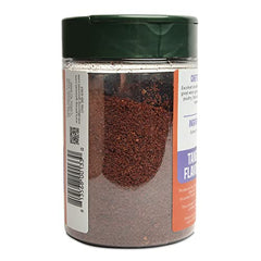 Closeup of Pereg Sumac spice powder highlighting vibrant red color.