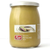 Pisti cream of pistachio from Sicily jar close-up, creamy spread ideal on bread.