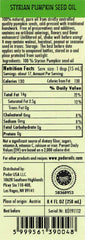 Pouring PÖDÖR Styrian pumpkin seed oil showing silky texture