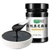 PoetrySeptember black sesame paste in a jar, silky texture perfect for dressings and spreads.