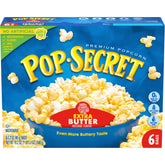 Pop Secret extra butter microwave popcorn bags steaming with a rich aroma.