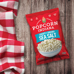 Popcorn Indiana Sea Salt Popcorn close-up highlighting glossy kernels and sea salt flakes.