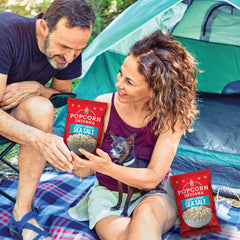 Popcorn Indiana Sea Salt Popcorn crunch close-up emphasizes crisp texture for snacking.