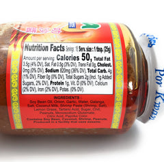 Por Kwan Laksa Paste chili-powder jar highlights bold heat for quick meals.