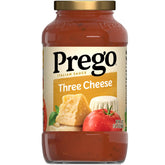 Prego Three Cheese sauce jar on kitchen counter, ideal for quick family dinners.