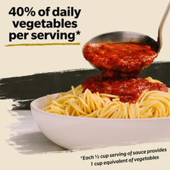 Vine-ripened tomatoes and herbs behind Prego sauce illustrate fresh ingredients.