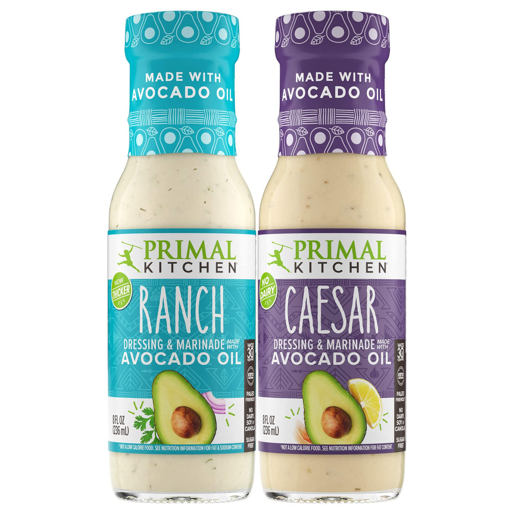 Primal Kitchen Ranch dressing bottle being poured; creamy texture ideal for salads.