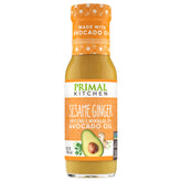 Primal Kitchen sesame ginger bottle pour showing versatile dressing option for salads