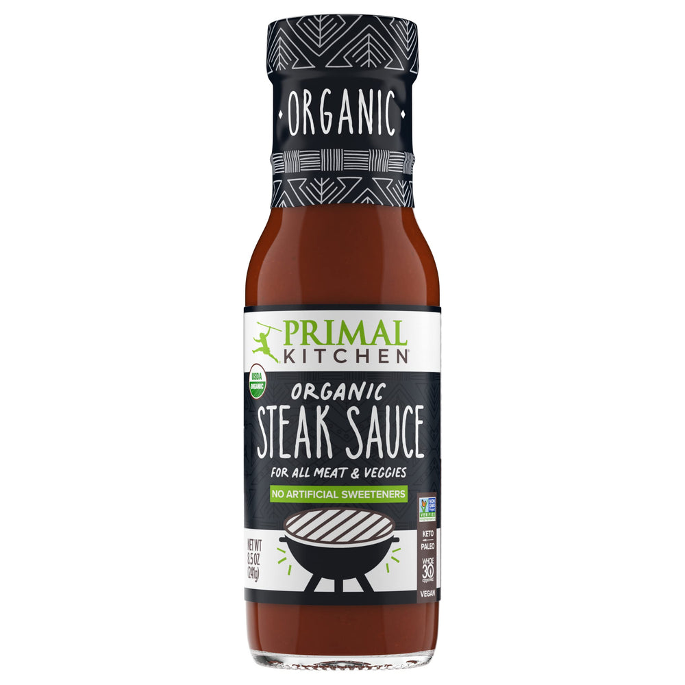 Primal Kitchen Organic Steak Sauce bottle highlighting USDA Organic and sugar-free flavor.