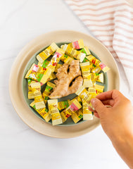 Prince of Peace Mango Ginger Chews held in hand with tropical flavor.