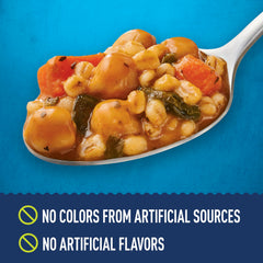 Can and spoon with Progresso Protein Hearty Grain Vegetable Soup ready to heat.