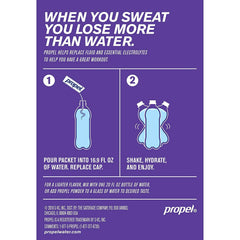 Propel grape powder packets served in a glass for quick hydration.