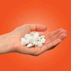 PUR Mints Tangerine Tango mints spill out for citrus flavor at hand.