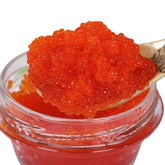 QIXINLIZYY premium salmon roe caviar jar with vibrant red pearls, ideal gift presentation.