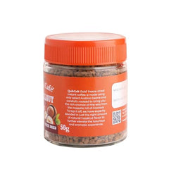 QuikCafé hazelnut coffee being poured into a mug highlighting easy solubility