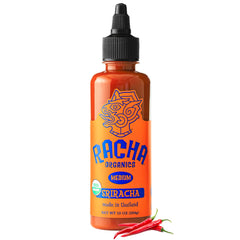 Racha Organics Orange Racha hot sauce bottle pouring for bold flavor.