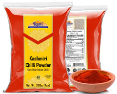 Rani Deggi Mirch powder spoon dusting enhances sauces with mild heat