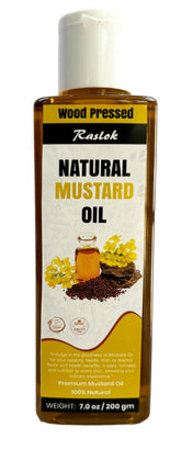 Raslok mustard oil bottle on kitchen counter; wood-pressed for rich flavor.