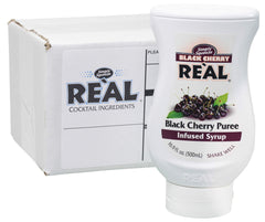 Reàl Infused Exotics Black Cherry Syrup bottle front highlighting premium cherry flavor.