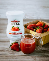 Reàl Infused Exotics Peach bottle adding sunny flavor to beverages